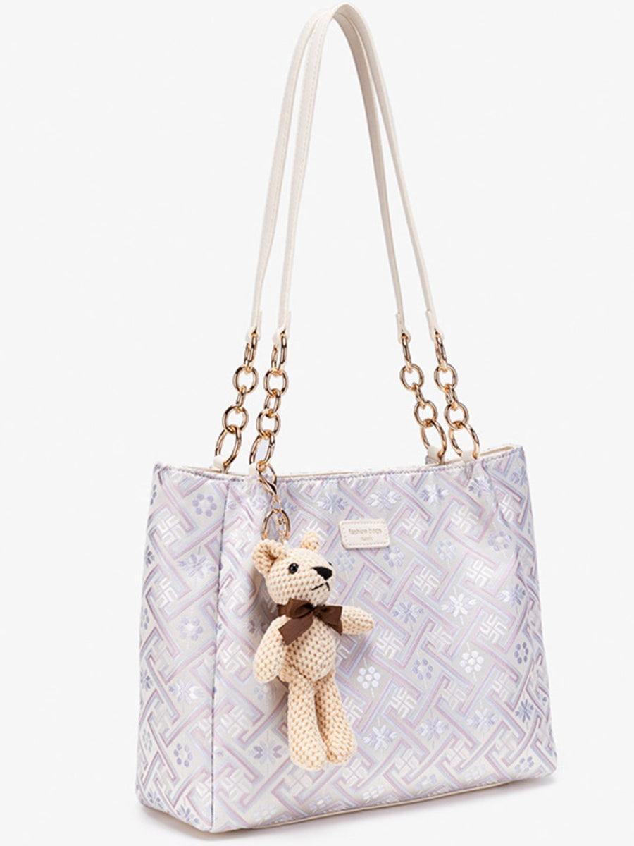 handbag in Pink Purple with geometric and detachable charm