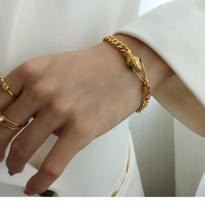 bracelet in gold featuring snake head design and regular fit
