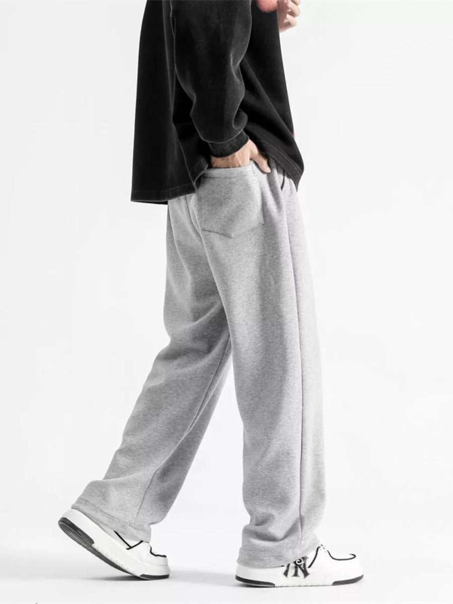 Light gray cotton sweatpants with a relaxed fit, wide leg, and drawstring waist.
