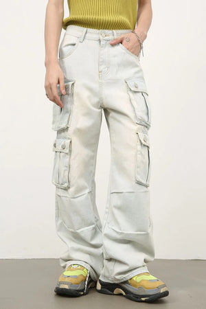 Light wash denim wide-leg cargo pants with multiple pleated pockets.