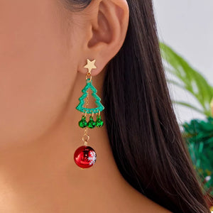 cherry red earrings featuring dangle and Christmas tree and snowflake motif