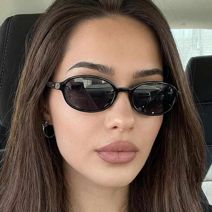 sunglasses in black featuring UV400 protection and oval fit