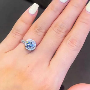 ring in silver featuring halo setting and round fit