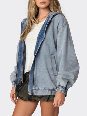 Light wash denim hooded jacket with elastic cuffs and hem, front zipper, and side pockets.