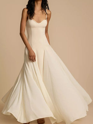 Elegant sweetheart neck maxi dress in ivory with a flowing skirt.