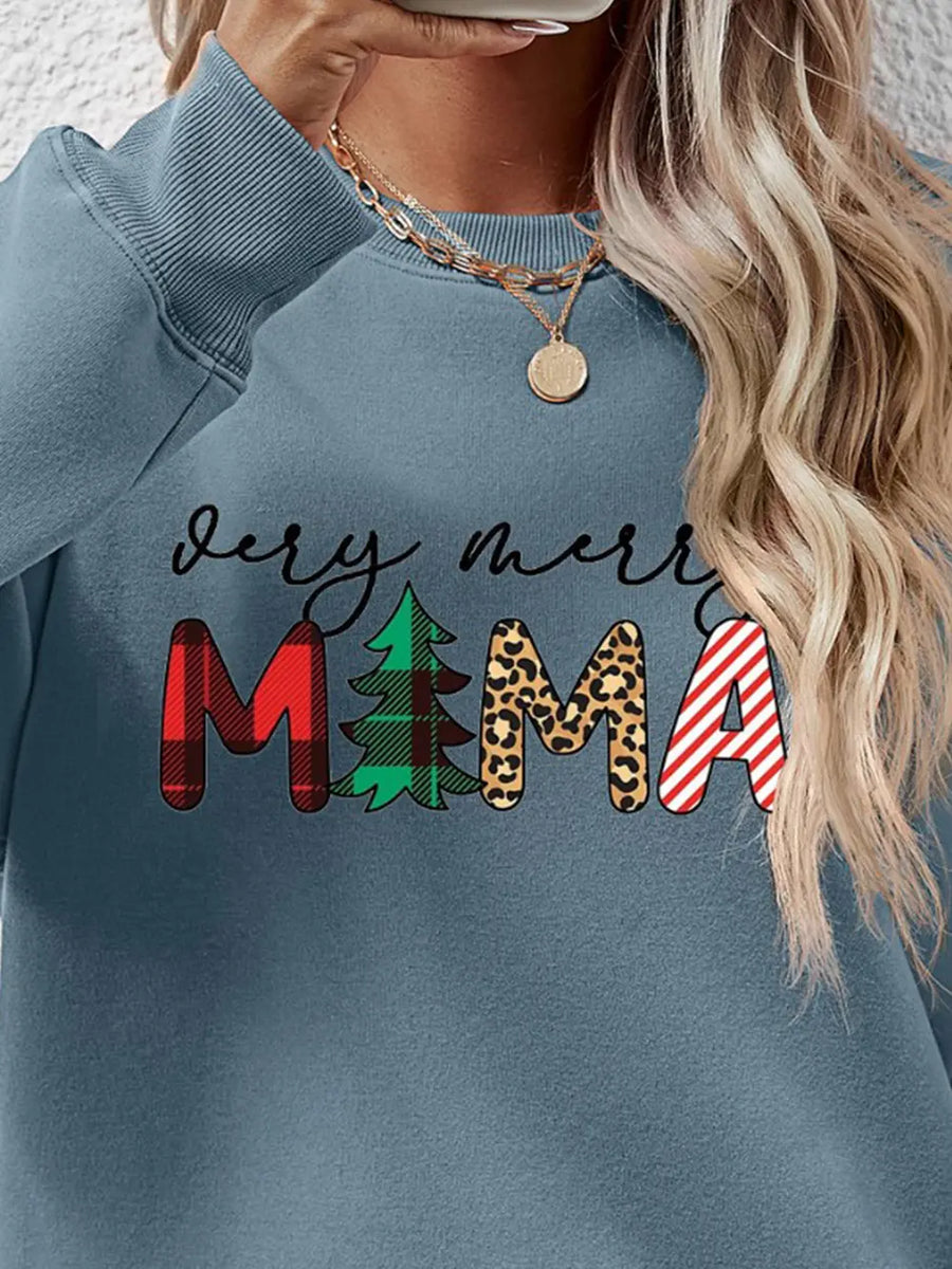 French Blue crewneck sweater with Merry Mama graphic, featuring plaid, tree, leopard, and stripe patterns.