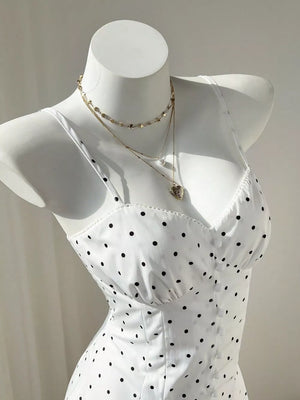 White mini dress with buttoned and spaghetti strap