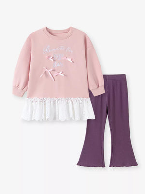 90% cotton, 10% polyester Care instructions: Machine wash cold sweatshirt in purple with relaxed silhouette