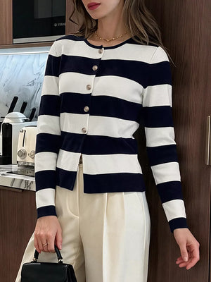 white cardigan featuring buttoned and striped