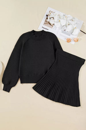 Black acrylic knit sweater set with balloon sleeves and a pleated skirt