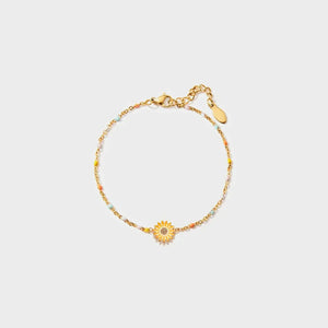 Gold beaded bracelet with colorful beads and a sunflower charm