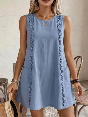 Light blue sleeveless dress with frill details and pockets.