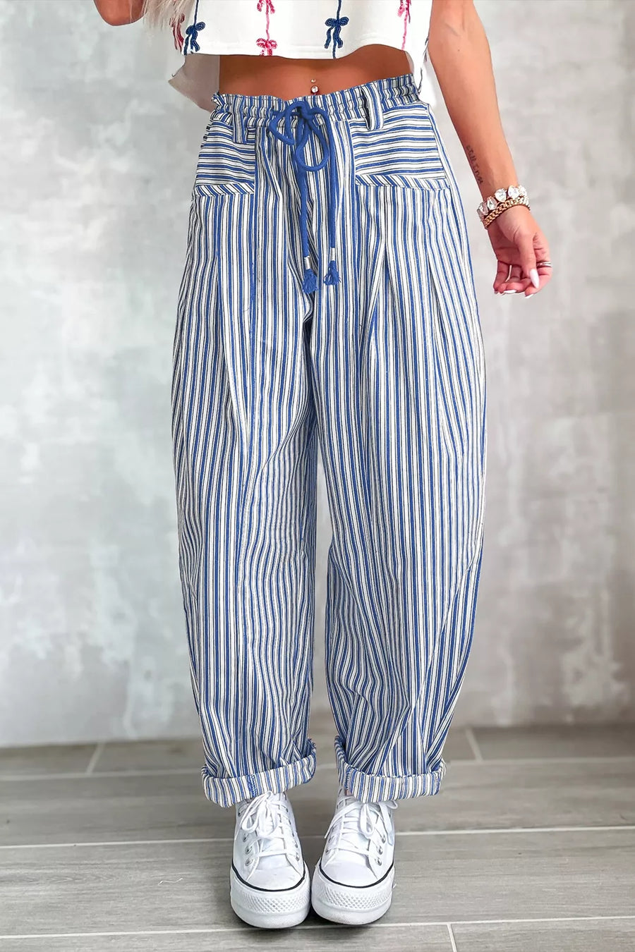 crimson red wide-leg pants featuring drawstring waist and striped