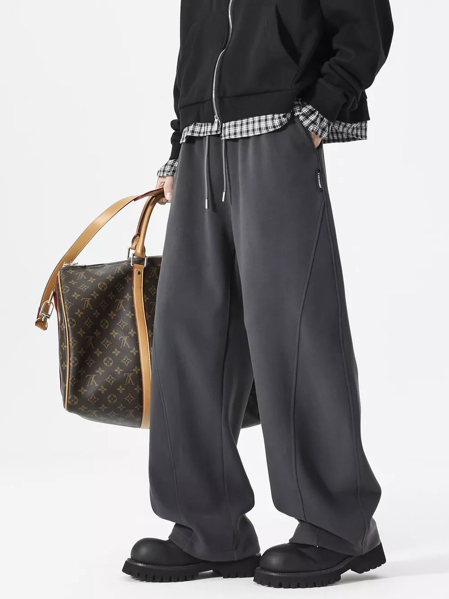 Men's gray relaxed fit drawstring sweatpants with diagonal seams