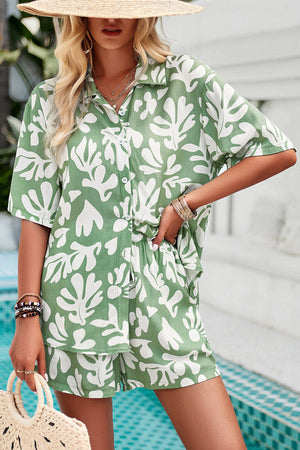 Light green abstract print resort shirt with button-down front and short sleeves.