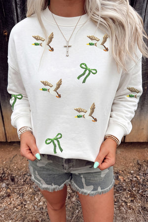 cream pullover sweater with graphic print and crew neck