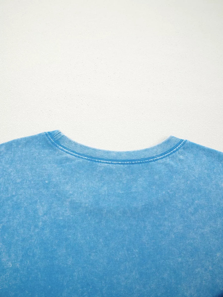 Mineral washed blue cotton crew neck t-shirt with a relaxed fit.