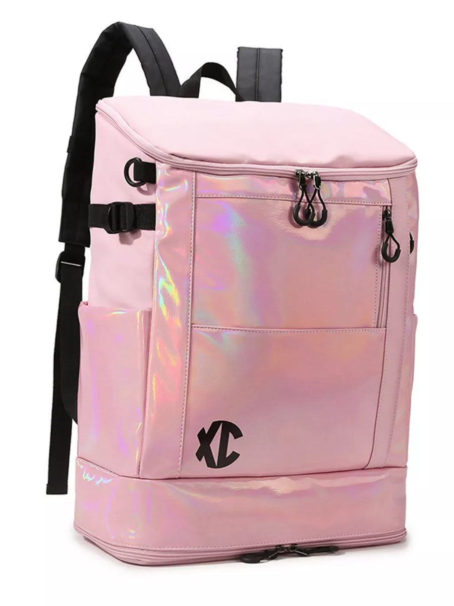 Pink travel organizer bag with iridescent panel and buckle closure.