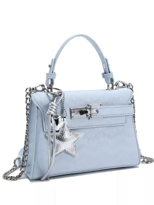 Blue embossed mini handbag with star charm and silver chain strap