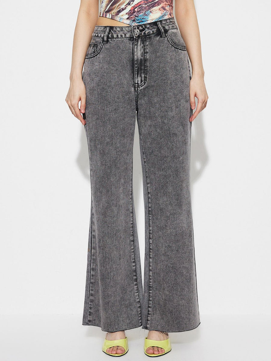 Acid wash flare jeans in dark gray cotton with a high-rise fit and buttoned front.