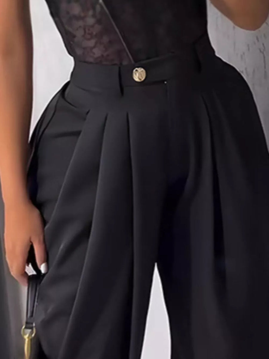Black pleated high-waisted pants with a button detail and wide leg.