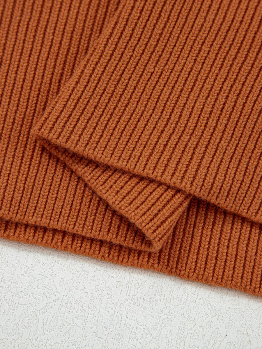 Caramel ribbed knit sweater with drop shoulder detail.