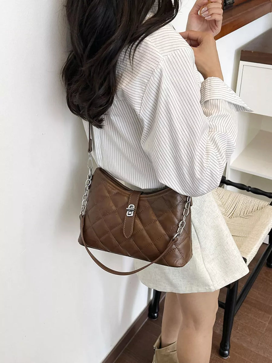 crossbody bag featuring quilted in chocolate brown with PU Leather Imported Size & texture