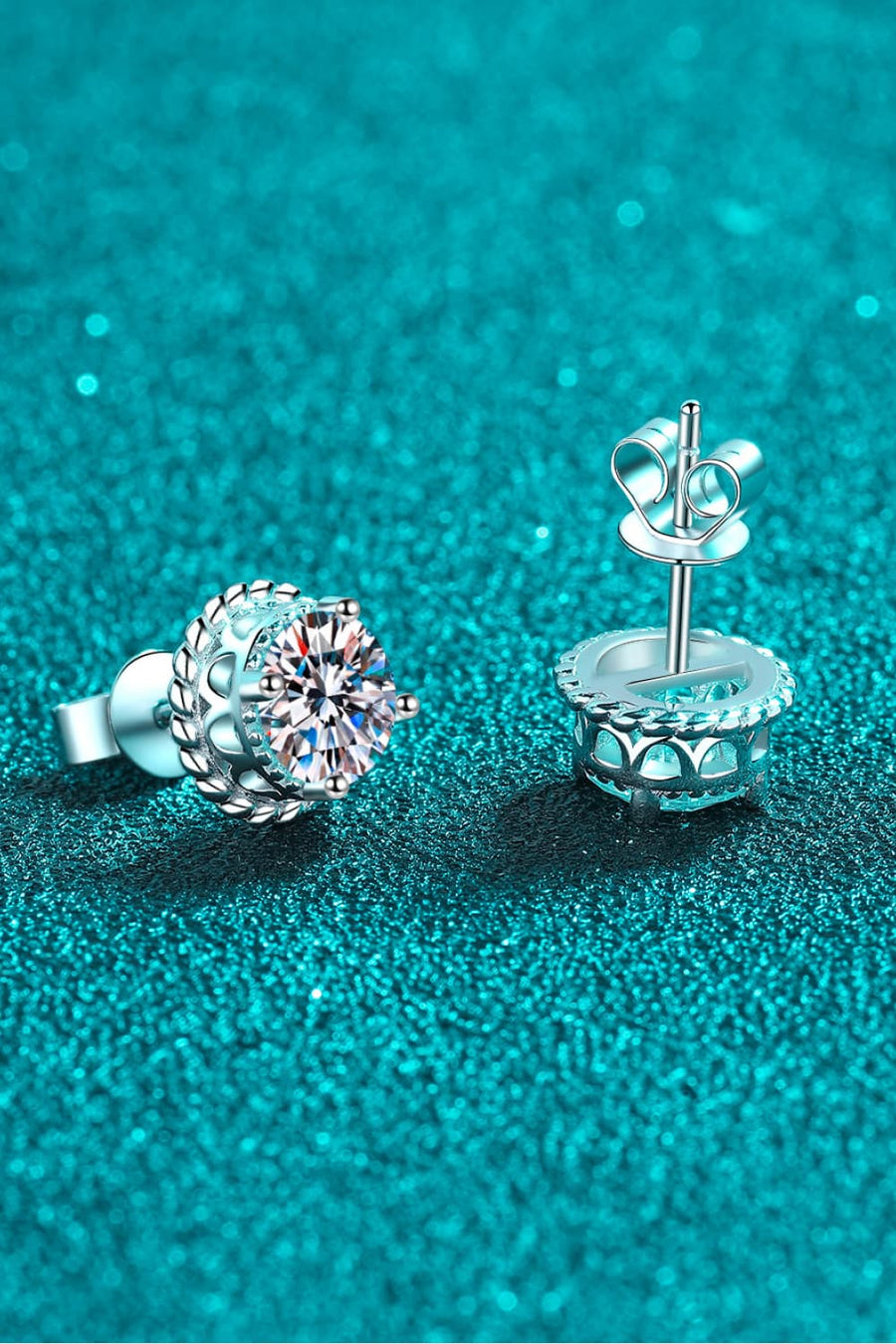 Sterling silver stud earrings with moissanite and rope-like frame detail.