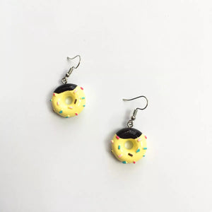 Yellow donut dangle earrings with black icing and colorful sprinkles