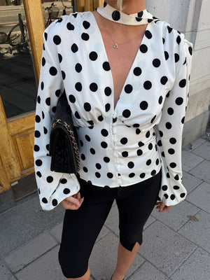 ivory blouse with polka dot and deep v-neck