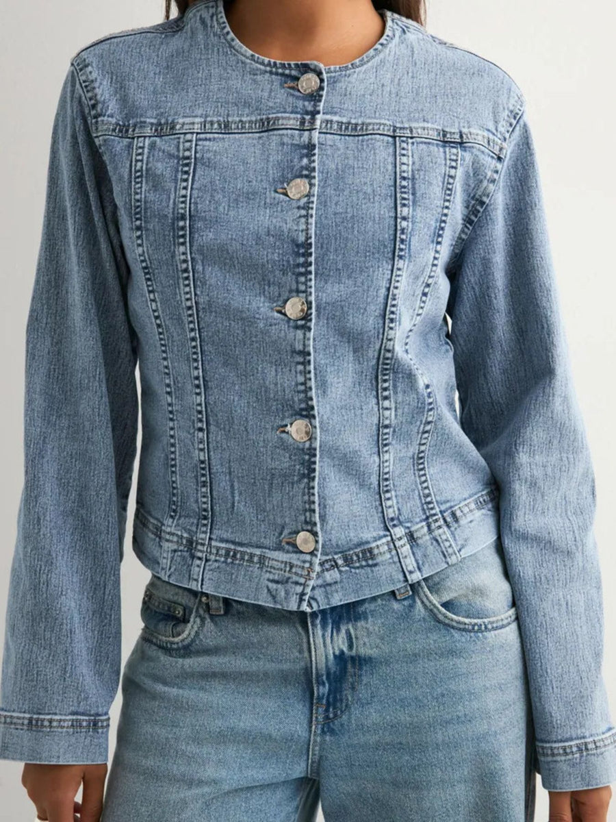 Denim jacket with seam detailing and button-down front.