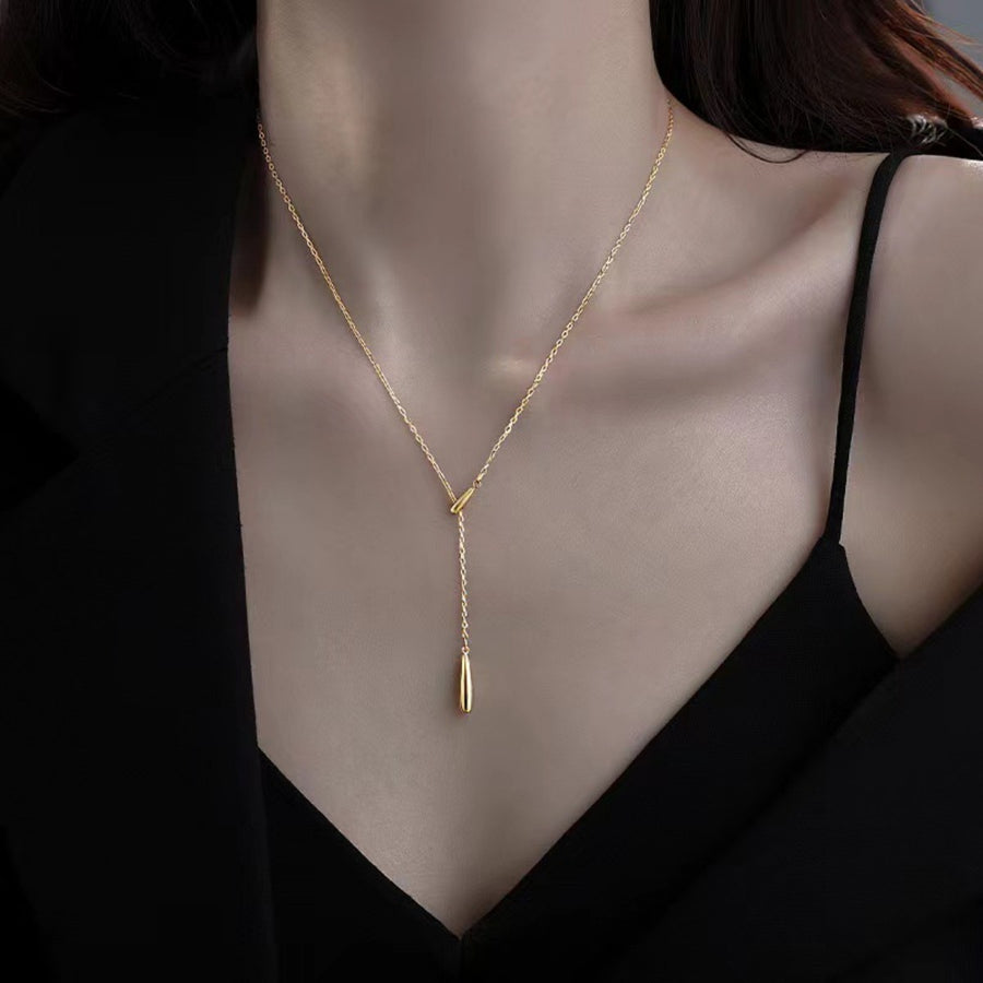 Gold Y-shaped pendant necklace in sterling silver with a delicate drop detail.