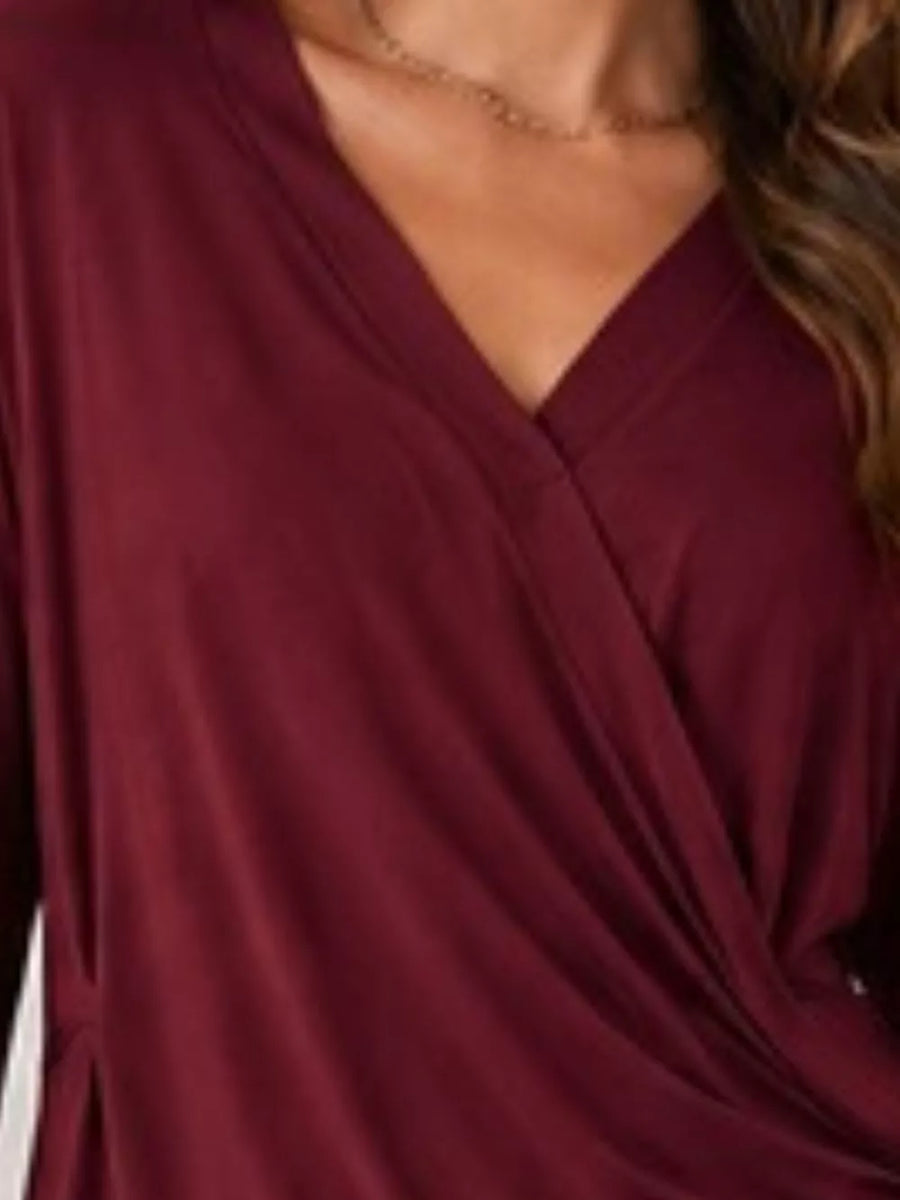 Black wrap top with hip-length and wrap