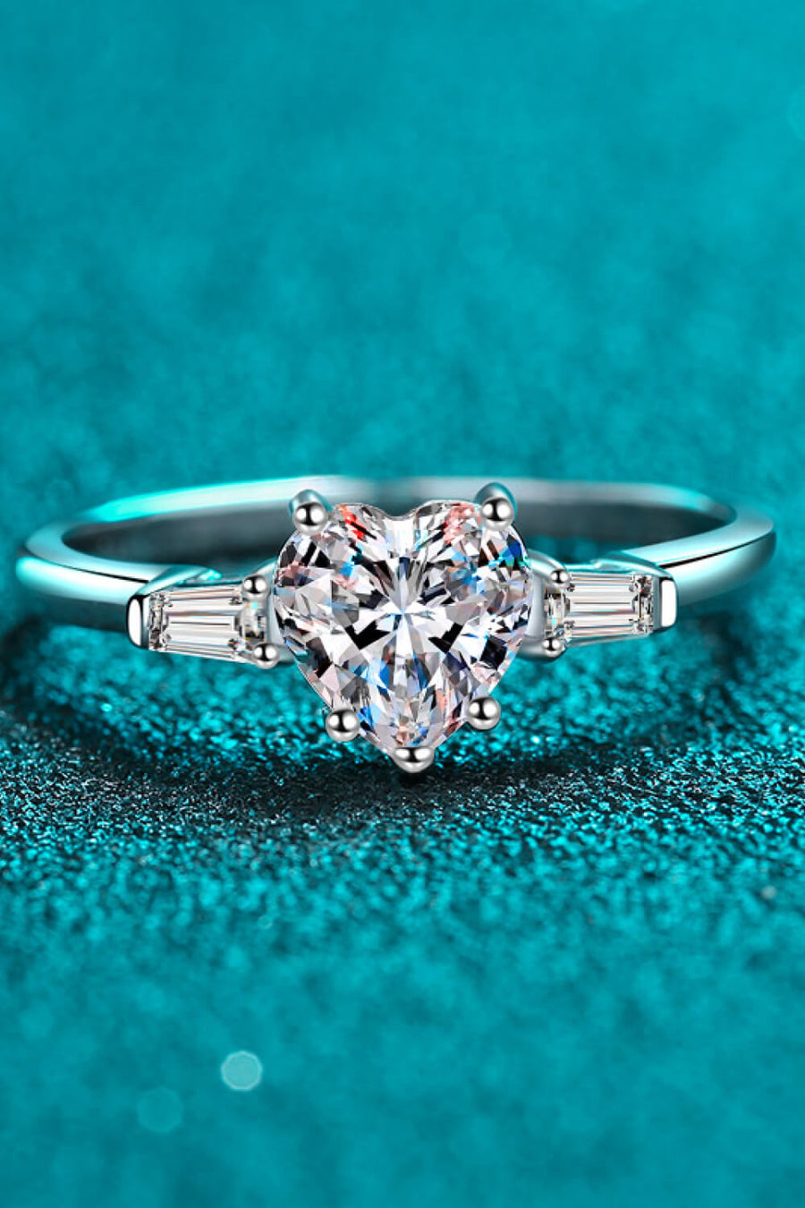 Silver ring with heart-cut moissanite and baguette stones