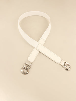 White faux leather belt with silver chain detail and elastic strap
