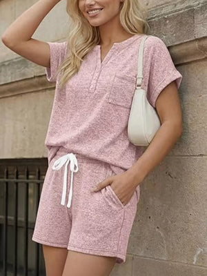 Pink relaxed two-piece set with pocketed top and drawstring shorts