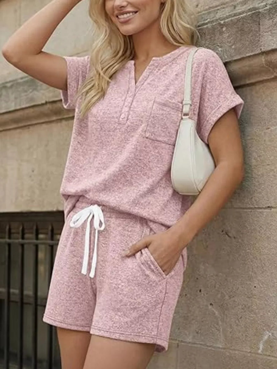 Pink relaxed two-piece set with pocketed top and drawstring shorts