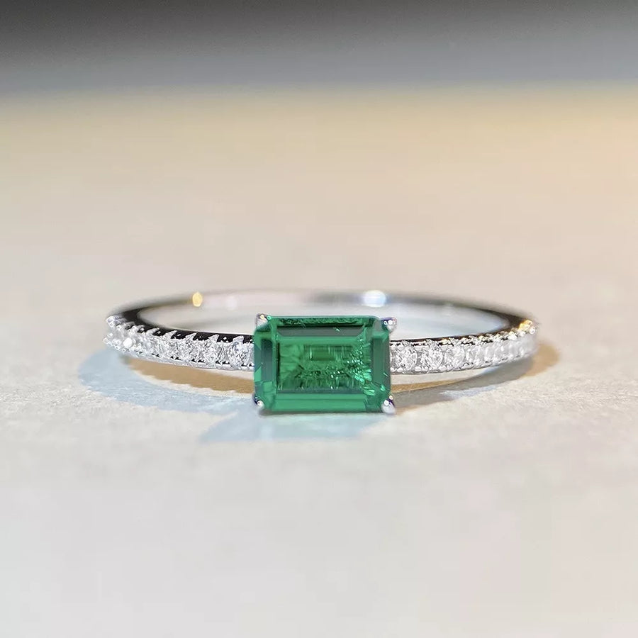 silver ring featuring zircon stone and geometric