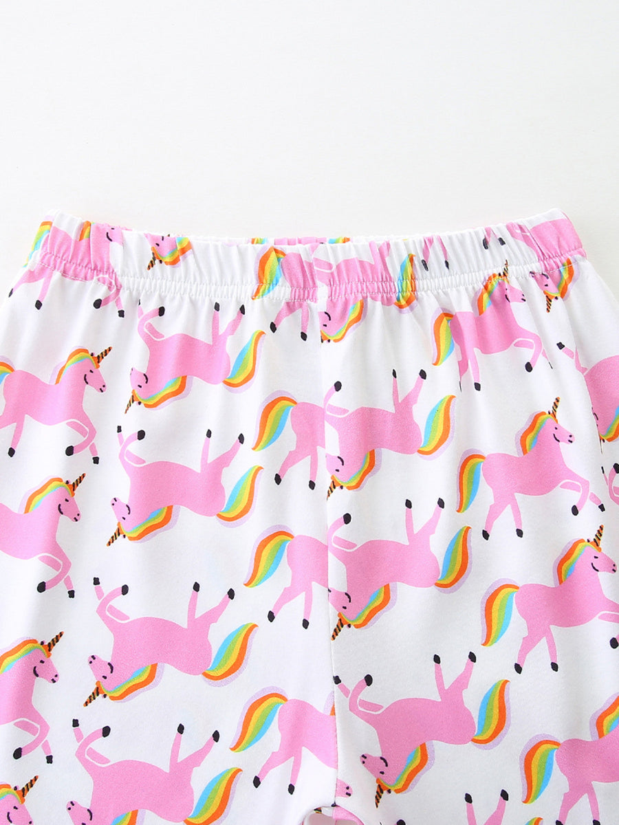 White girls' undershirt with pink unicorns and rainbow tails print.