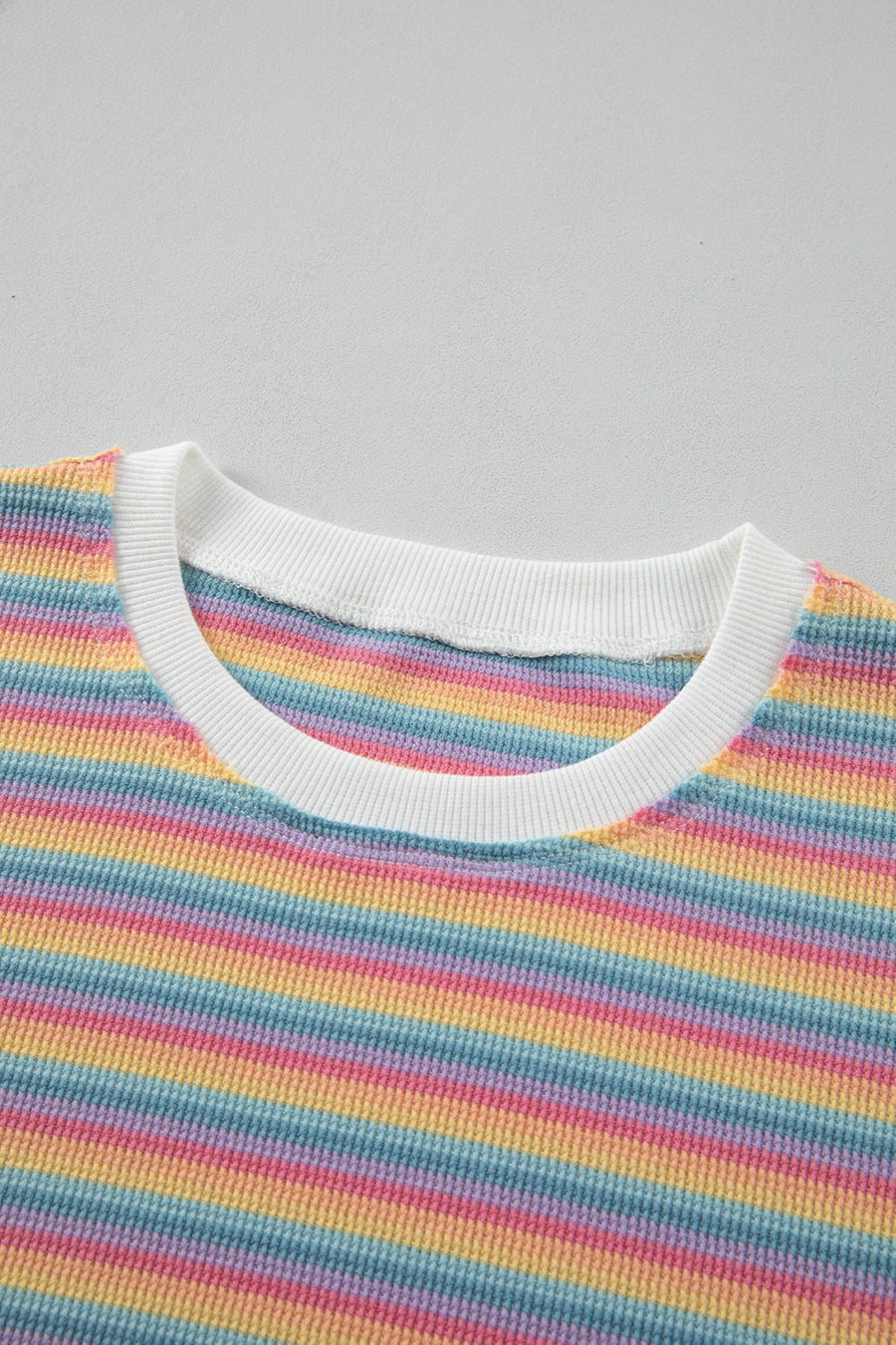 Rainbow stripe cotton loungewear set with white crew neck and ribbed trim.