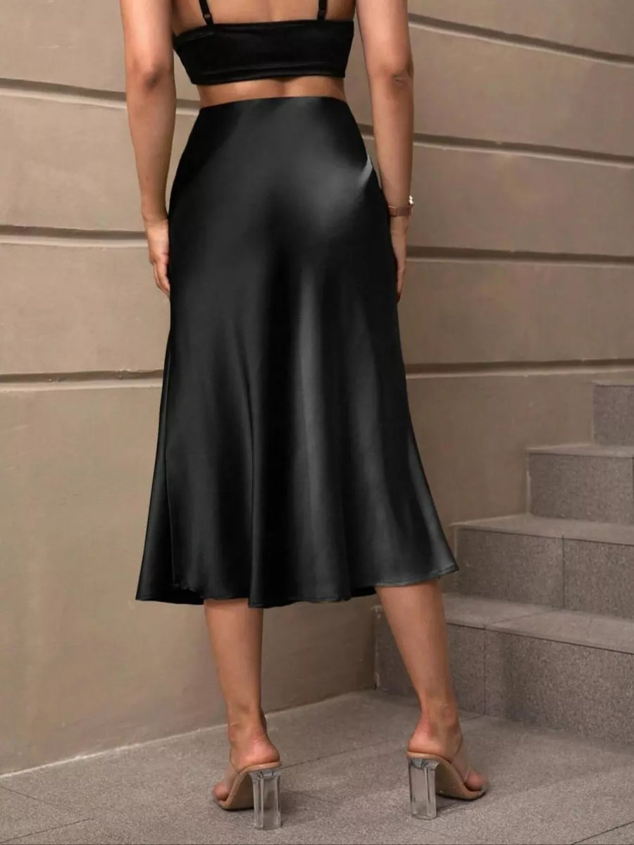 Black satin high-waisted midi skirt with a flowing A-line cut.