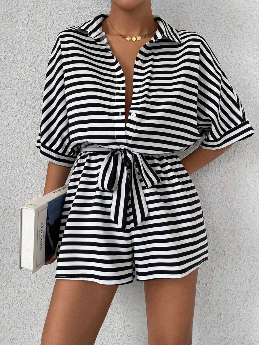 Black and white striped shirt romper with self-tie belt and button front.