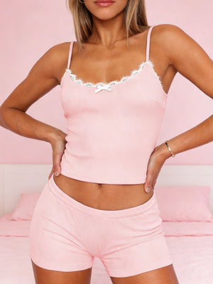 Blush pink cami and shorts set with lace trim and a bow detail.