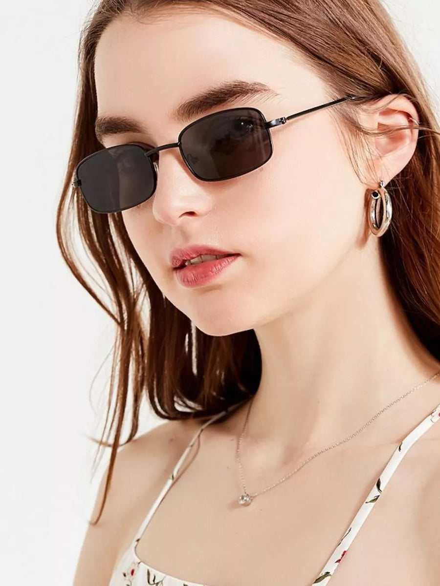 sunglasses in black featuring UV400 protection and rectangular fit