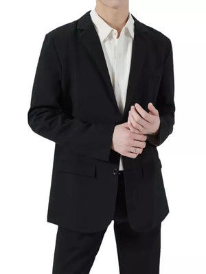 Men's black classic fit sport jacket with button closure and notch lapel, worn over a white shirt.
