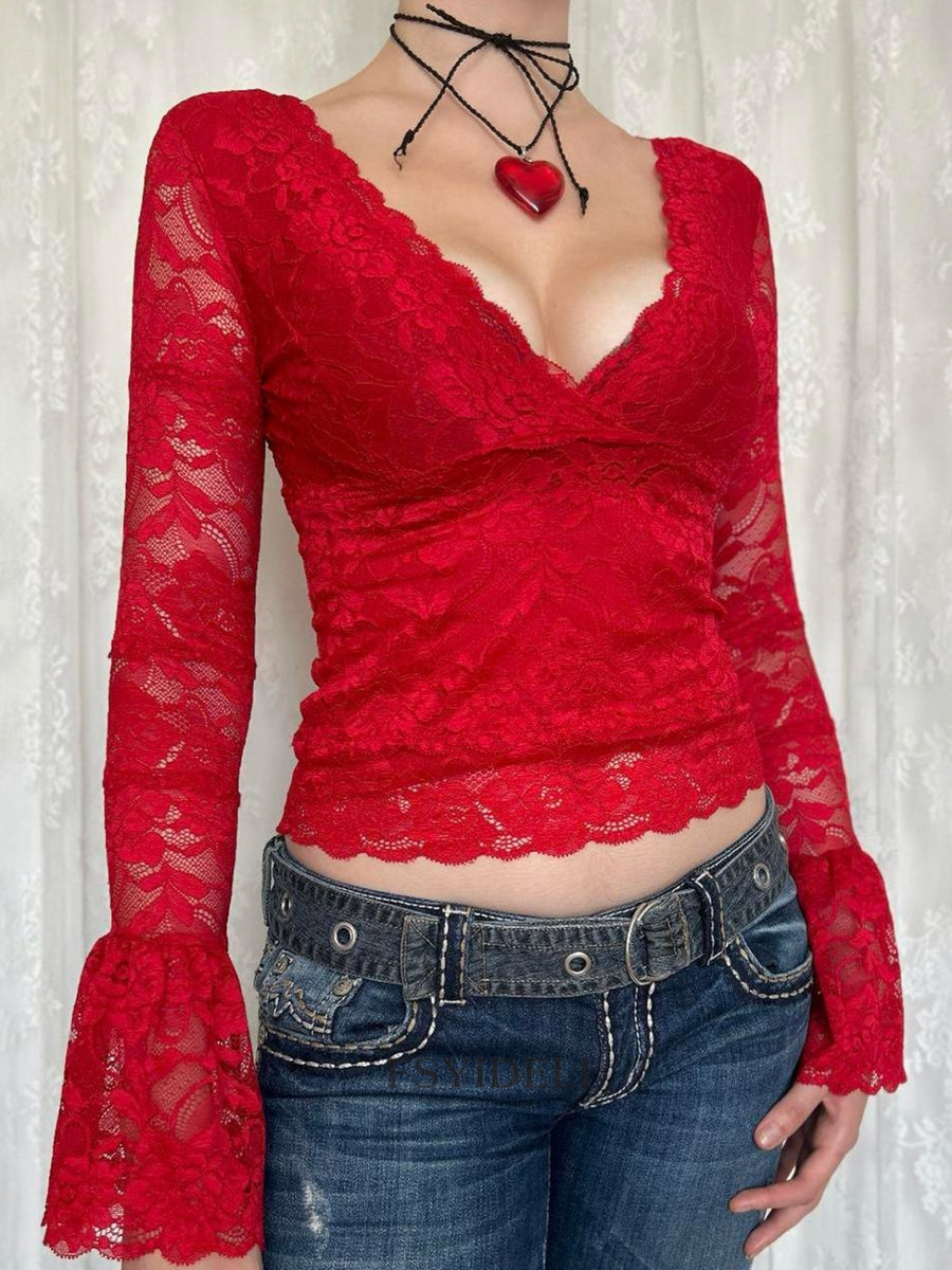Red lace surplice blouse with scalloped trim and bell sleeves.