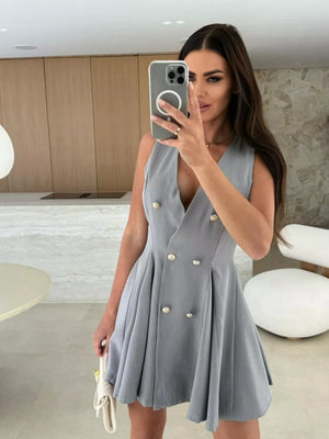 Gray double-breasted mini dress with gold buttons and pleated skirt