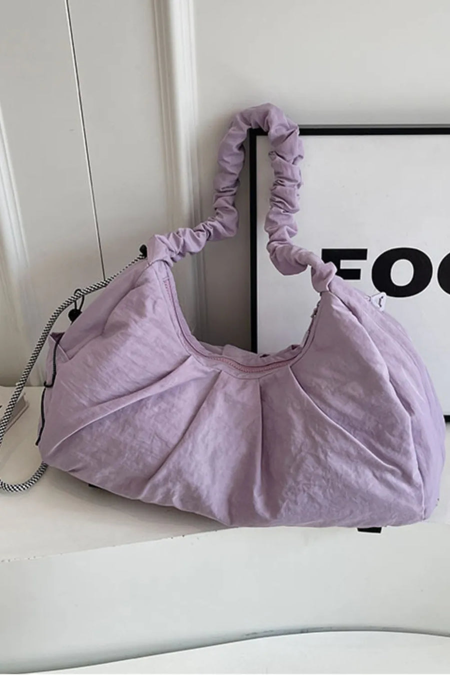 Lilac gathered crescent shoulder bag with ruched strap and pleated detail
