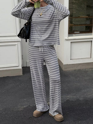 95% polyester, 5% elastane Care instructions: Machine wash cold pajama set in Gray with relaxed silhouette