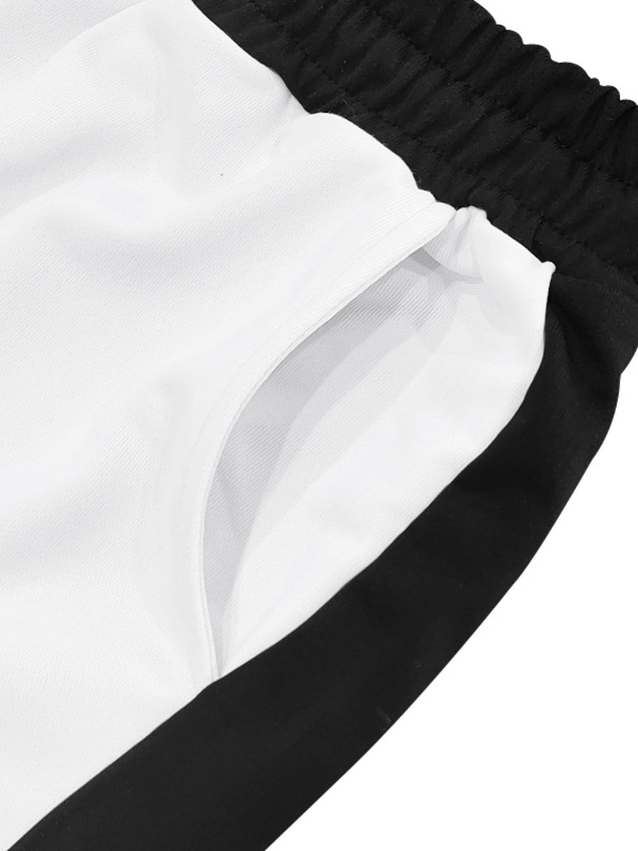 White sweatpants with black side stripe detail and pocket.